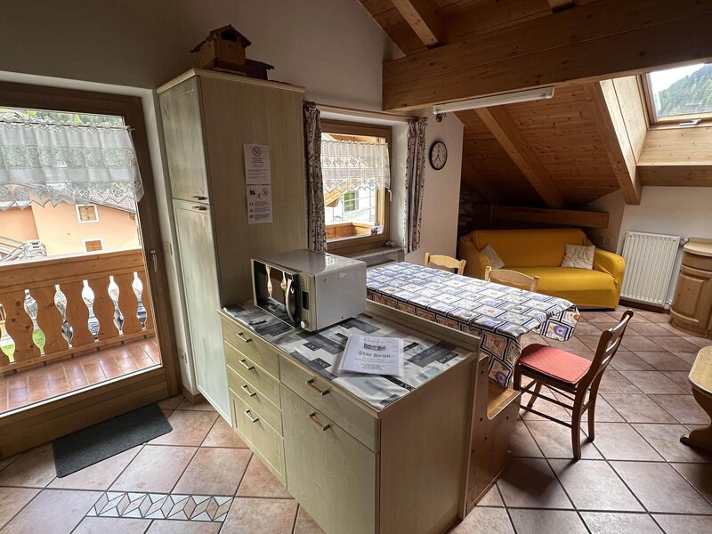 Kitchen with living room and large balcony