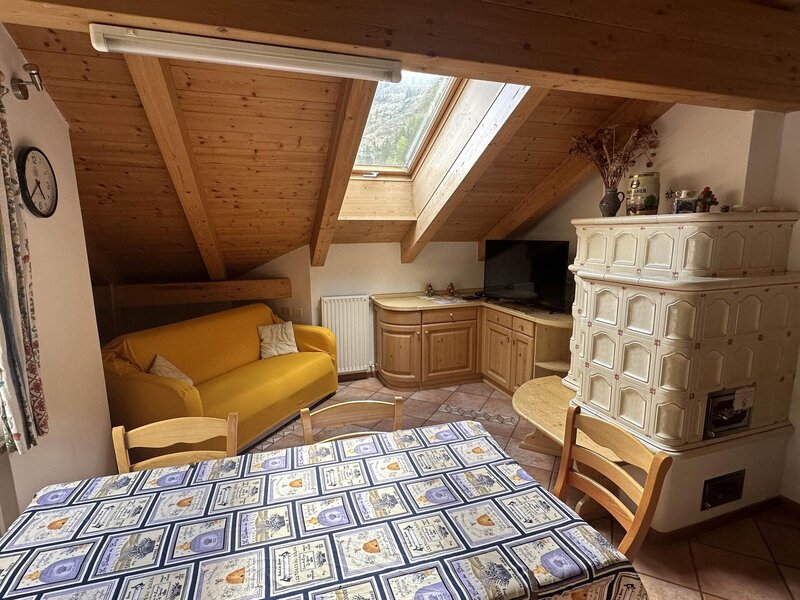 Attic living room with stove (or mussa)