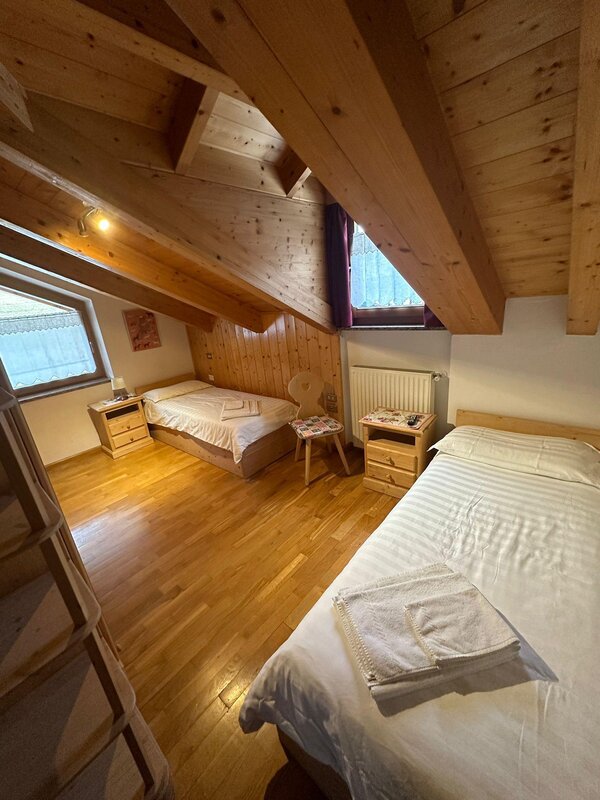 Spacious and bright room with two separate beds